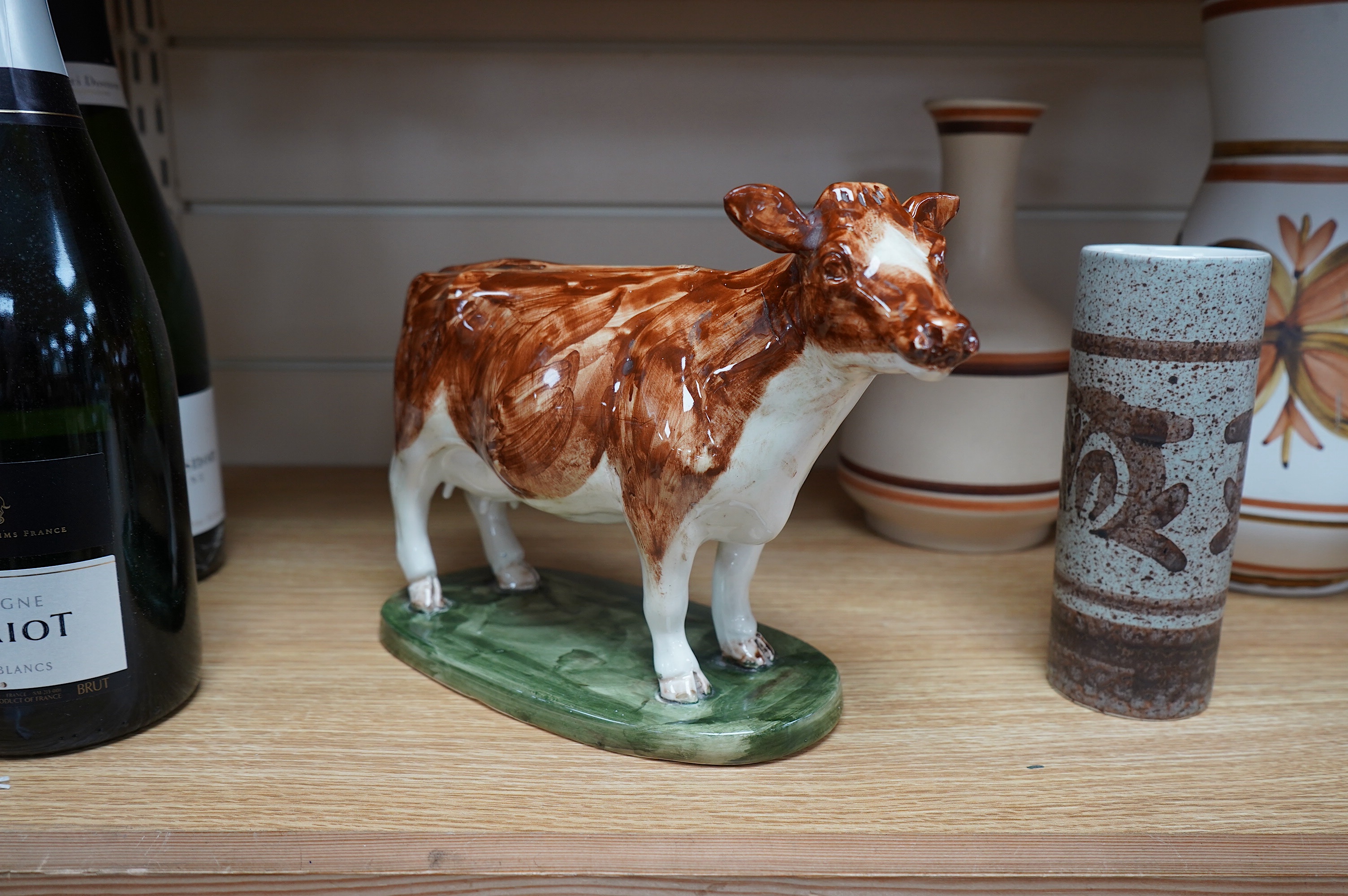 David Sharp, an Ayrshire cow produced for Bayer, and three Cinque Ports Rye vases and a carafe, largest 28cm high. Condition - good